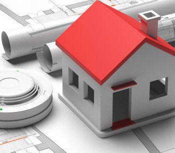 Fire safety system, home emergency evacuation. Smoke detector and small house on blueprint drawing background. Domestic fire protection. 3d illustration